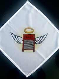 a white handkerchief with an angel and wings on it
